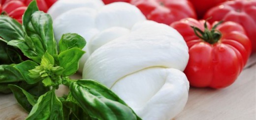 Delicious bulls heart (or heirloom) tomatos with fresh green basil